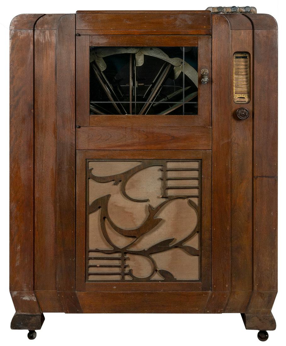 Mills Novelty Co. Dance Master Jukebox. Chicago: ca.: Mills Novelty Co. Dance Master Jukebox. Chicago: ca. 1930. Wood cabinet with ornate floral designs. 51 ½ x 39 x 21”. Working (needs adjustments). Key included. Third party transportation re