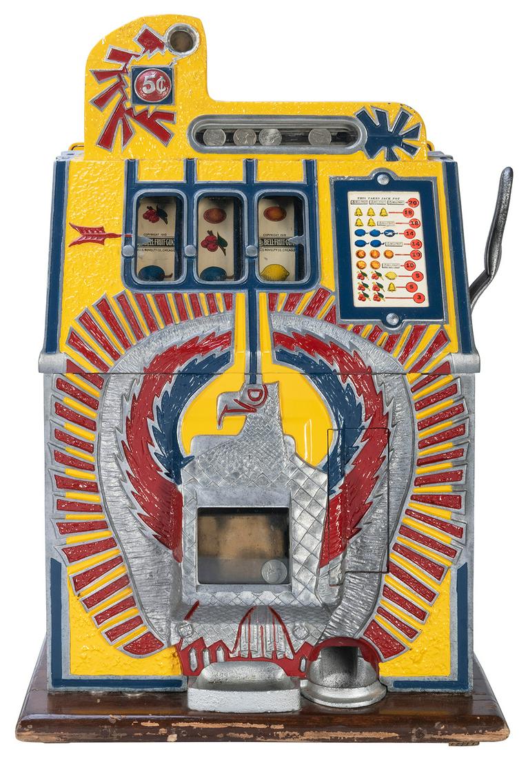 Mills Novelty Co. 5 Cent War Eagle Slot Machine.: Mills Novelty Co. 5 Cent War Eagle Slot Machine. Chicago: ca. 1930s. Brightly painted in yellow, blue, red. 25 x 17 ½ x 15”. Crack at coin casing. Lock and key. Not functioning. Third party