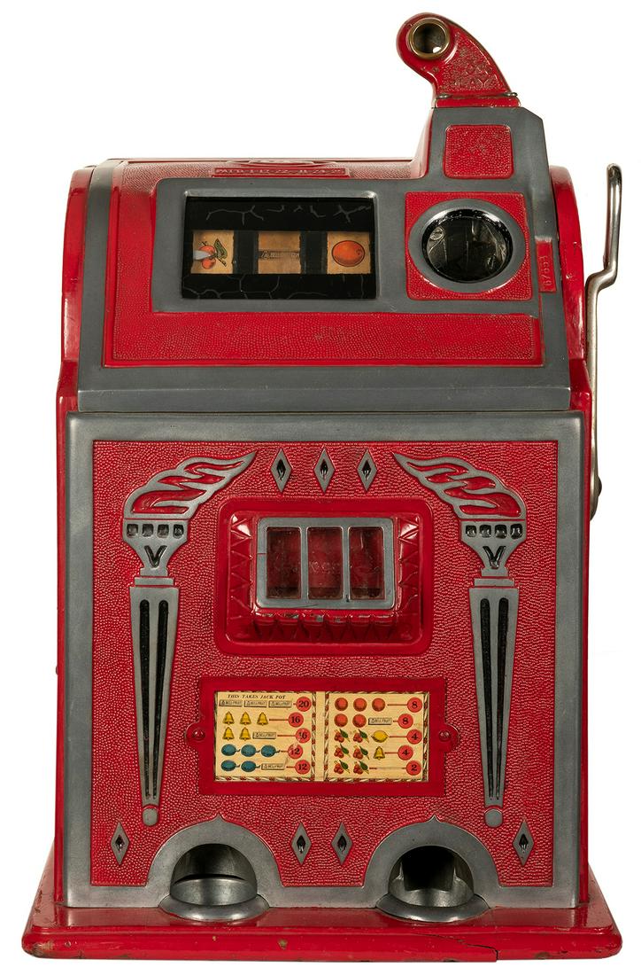O.D. Jennings & Company 5 Cent “Torch” Slot: O.D. Jennings & Company 5 Cent “Torch” Slot Machine. Chicago: ca. 1920s. 24 x 14 x 15”. Casing cracked at two points. Keys included. Third party transportation required.