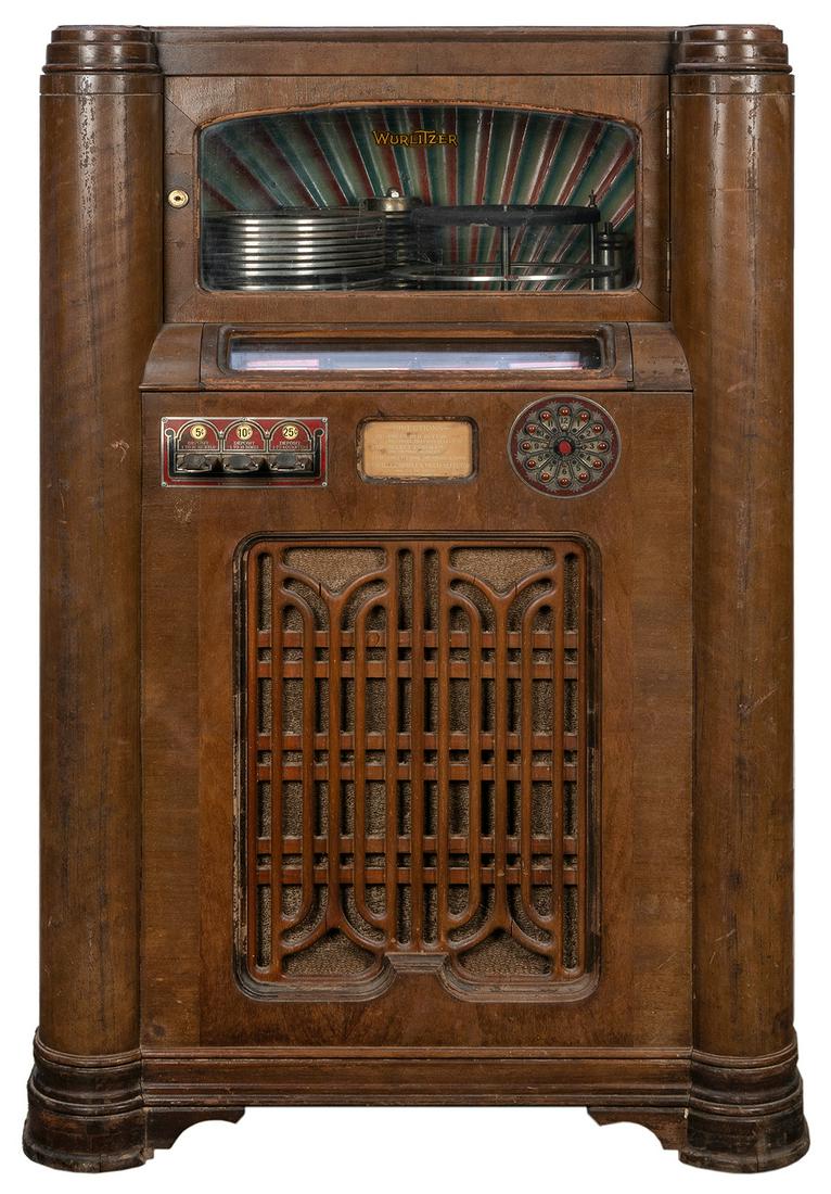 Wurlitzter 412 Jukebox. Cincinnati: Rudolph Wurlitzer: Wurlitzter 412 Jukebox. Cincinnati: Rudolph Wurlitzer Co., ca. 1937. Plays 78 RPM records. 52 x 30 x 22”. Wood cracked, peeling. Working. Key included. Earliest electric jukebox manufactured by 