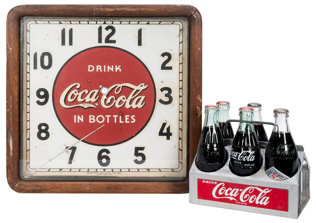 Coca-Cola Aluminum Bottle Carrier. Circa 1960s.: Coca-Cola Aluminum Bottle Carrier. Circa 1960s. Includes five full bottles dating from the 1970s/80s. 8 ½ x 8 x 5 ½”. Includes vintage Drink Coca-Cola in Bottles wall clock (untested;