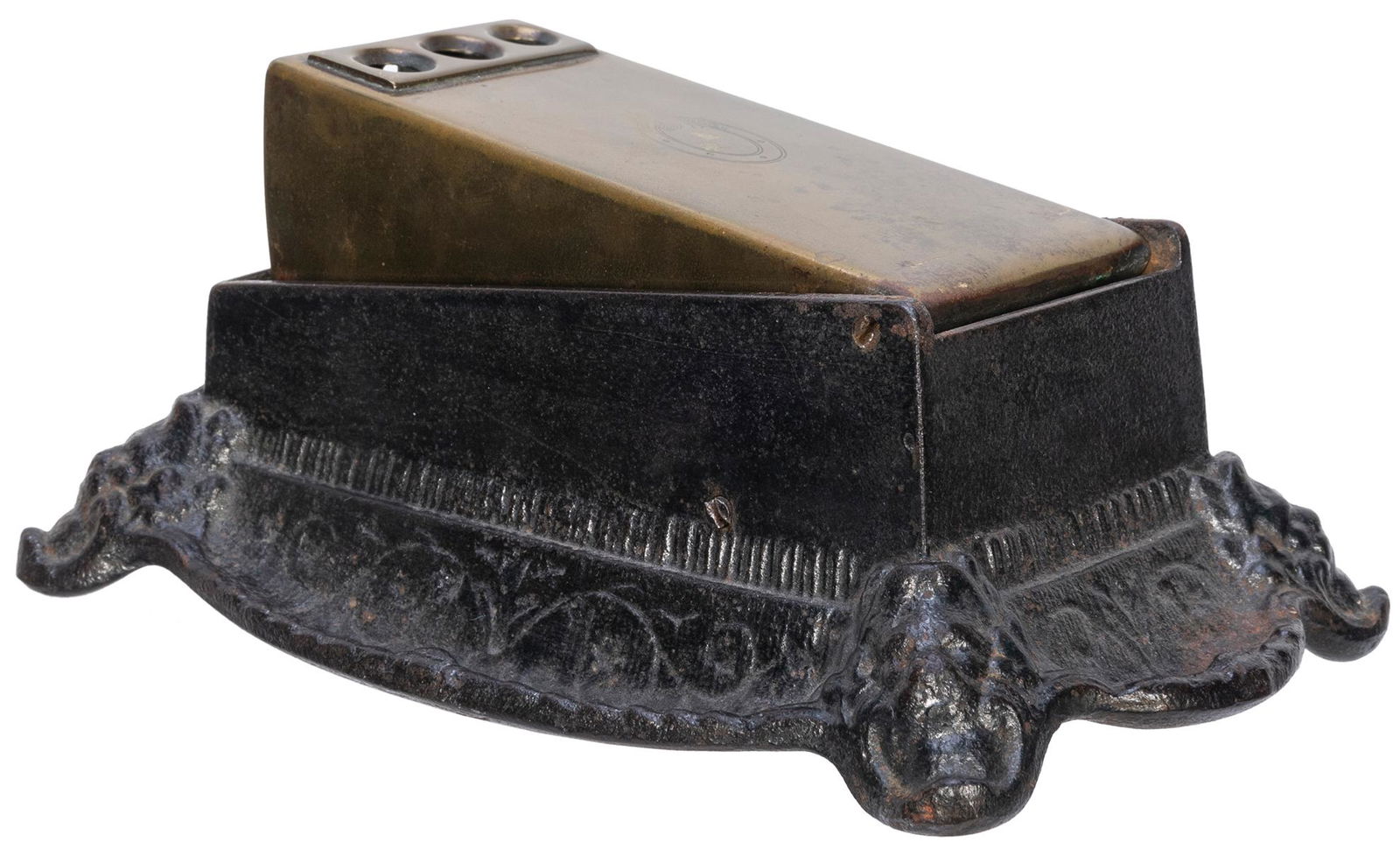 [TOBACCIANA]. Cigar Cutter. 20th century. Cast iron: [TOBACCIANA]. Cigar Cutter. 20th century. Cast iron cigar cutter with later brass cover emblazoned with a horseshoe. 7 x 4 ½ x 2 ½”.