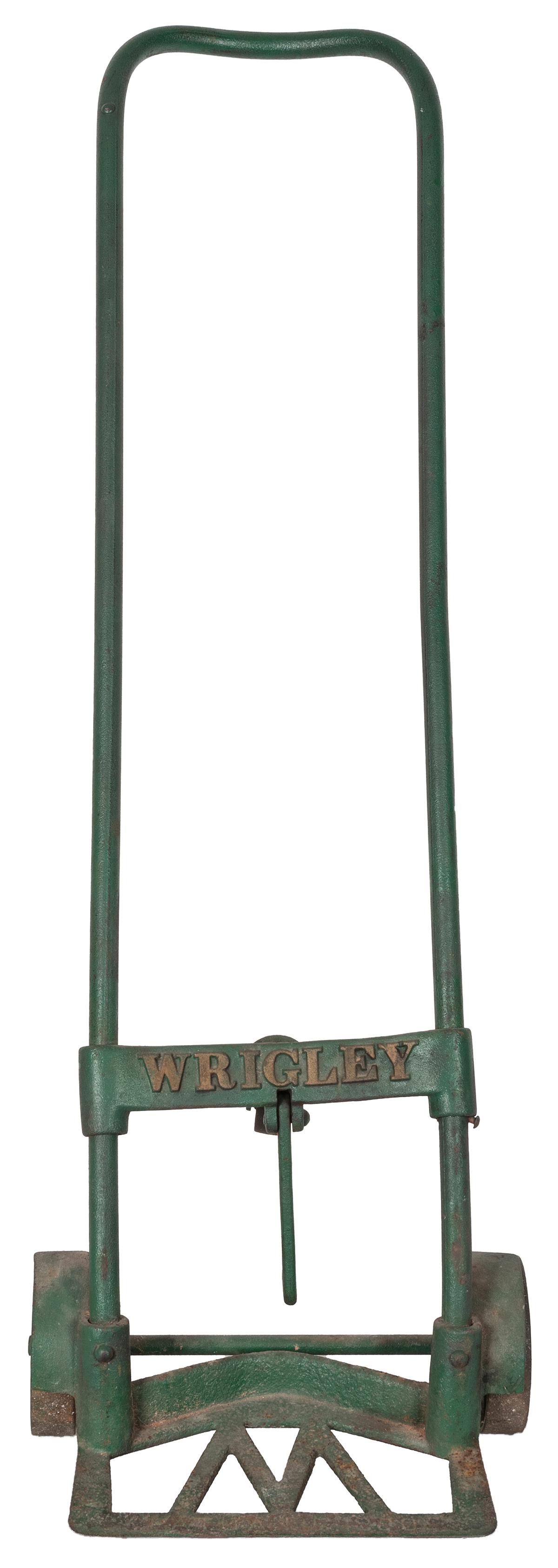 [BASEBALL]. Wrigley Field Dolly Cart. Circa 1940s. Cast: [BASEBALL]. Wrigley Field Dolly Cart. Circa 1940s. Cast iron dolly cart used for transporting kegs of beer at Wrigley Field with caster on back. Height, 45”.