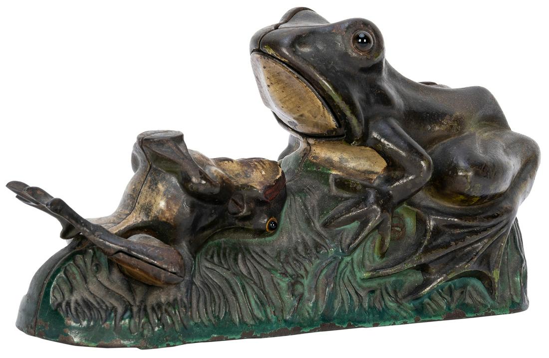 Two Frogs Bank. Cromwell, CT: J.E. Stephens, 1890s. The: Two Frogs Bank. Cromwell, CT: J.E. Stephens, 1890s. The smaller frog kicks a coin into the larger bullfrog’s mouth when the lever is pushed. Cast iron mechanical bank with original paint, length