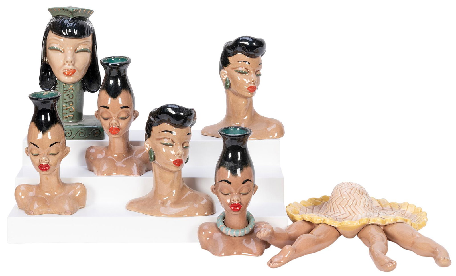 KINDELL, Dorothy (1909-?). 1940s-50s Polynesian and: KINDELL, Dorothy (1909-?). 1940s-50s Polynesian and Zulu Ceramic Vase Collection. Laguna Beach, CA. A collection of glazed pottery vases depicting Asian and African women’s busts. Largest 7̶