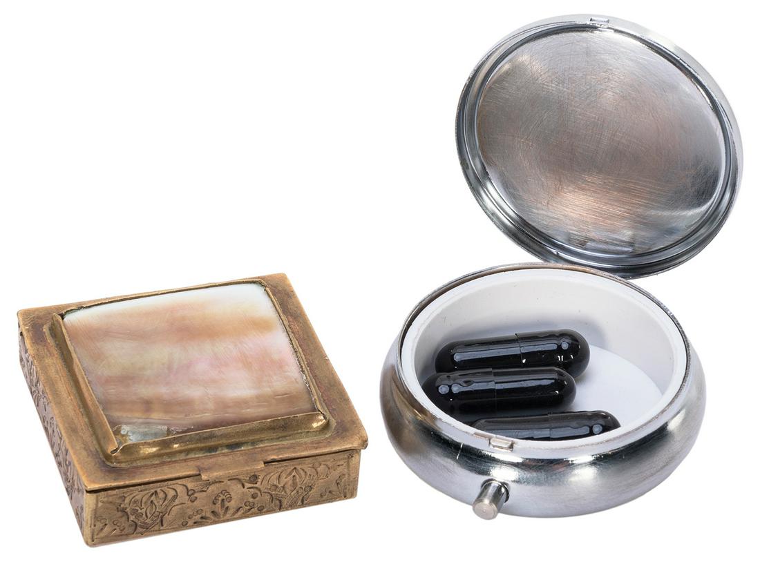 A Pair of Screen-Used Pill Boxes from Sense8. Original scre...: A Pair of Screen-Used Pill Boxes from Sense8. Original screen-used pill boxes as seen being used by Yrsa and Mrs. Stromness, respectively, each containing gelatin blocker capsules. Each measures appro