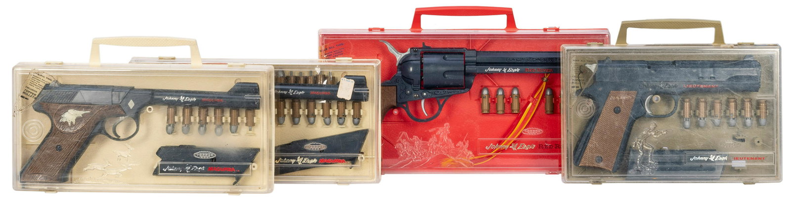 Johnny Eagle Magumba / Red River Toy Gun Collection (6). In...: Johnny Eagle Magumba / Red River Toy Gun Collection (6). Includes Johnny Eagle Red River revolver in case with bullets and instructions; [2] Johnny Eagle Magumba toy pistol sets in cases (one without 