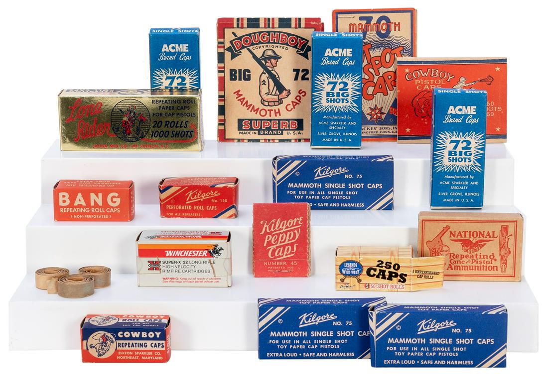 [CAP GUNS]. Collection of Cap Gun Caps, Boxes, and Accessor...: [CAP GUNS]. Collection of Cap Gun Caps, Boxes, and Accessories. Large accumulation of vintage individual packages (not individually checked, including some empty) of caps for cap pistols, assorted bra