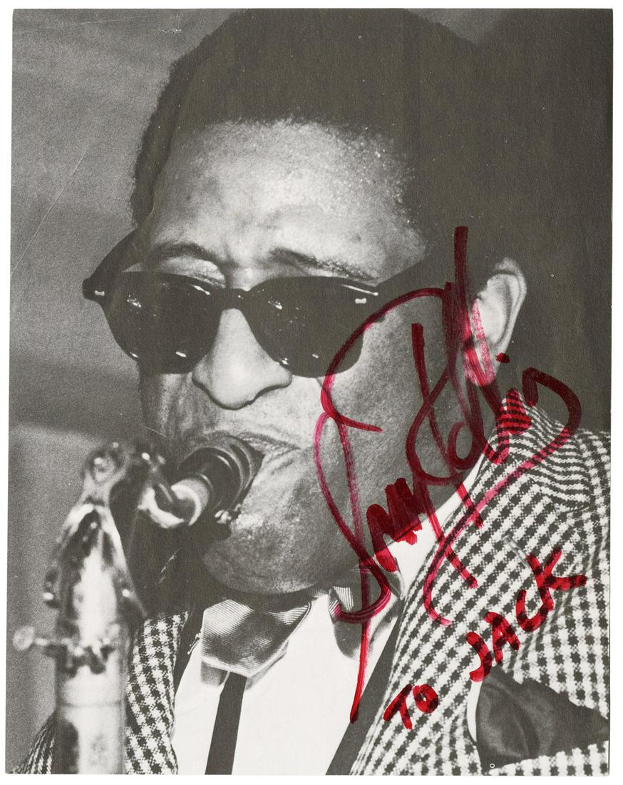 [ROLLINS, Sonny (b. 1931)]. Publicity Still Signed by Sonny...: [ROLLINS, Sonny (b. 1931)]. Publicity Still Signed by Sonny Rollins. Black and white publicity still depicting Sonny Rollins in sunglasses blowing on a saxophone. 7 ½ x 6”. SIGNED BY SONN