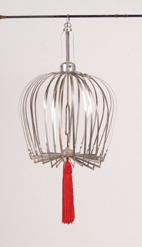Production Bird Cage. Merv Taylor, ca. 1955: Production Bird Cage. North Hollywood, Merv Taylor, ca. 1955. A round, collapsible stainless steel bird cage which can be produced from a bundle of silk handkerchiefs; the cage opens to a diameter of 