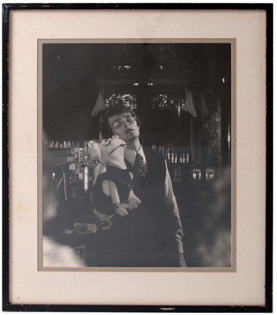 3 oversized photos of Tom Mullica at the Tom-Foole: Mullica, Tom. Three oversized photos of Tom Mullica at the Tom-Foolery. In two photographs, Mullica lampoons with his rabbit puppet Duke; in the third, he stands behind the bar. 16 x 20". Photographer