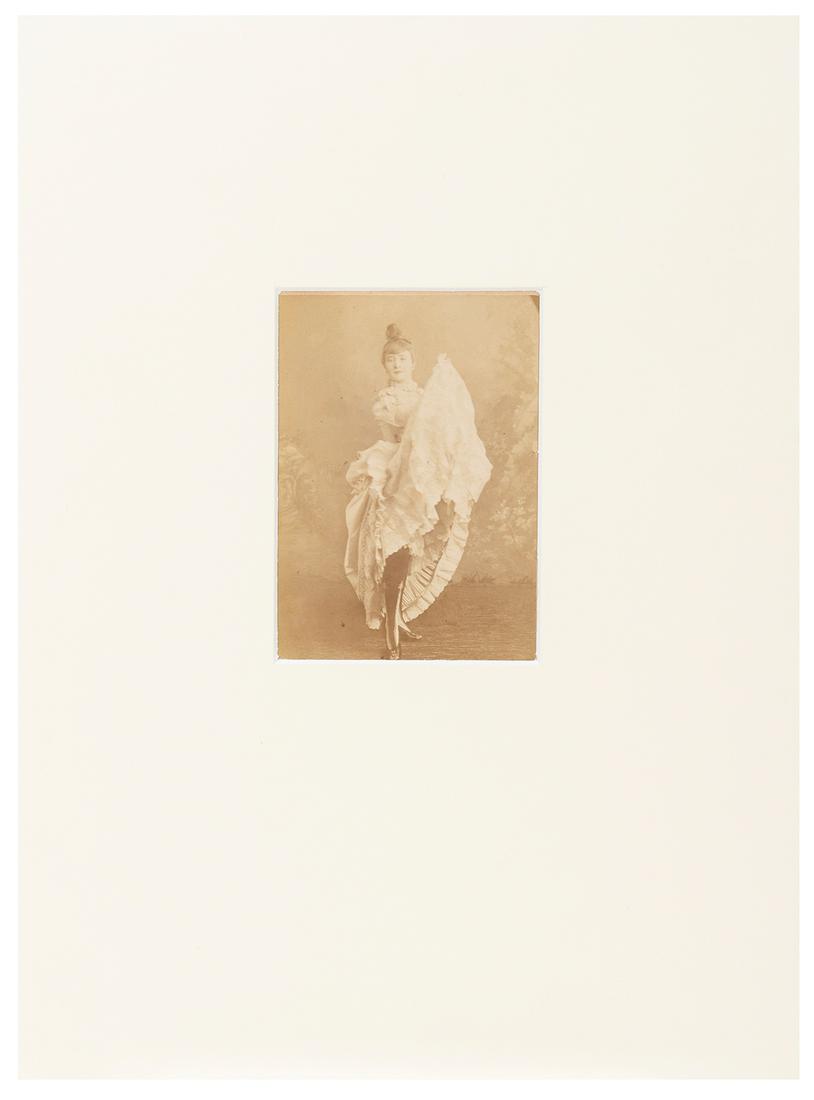 LA GOULUE (stage name of Louise Weber, 1866-1929). Albumen ...: LA GOULUE (stage name of Louise Weber, 1866-1929). Albumen Cabinet card portrait of the famous dancer. [Paris: ca. 1880s]. Visible image: 140 x 100 mm. Matted. Some toning, a few small spots of soilin