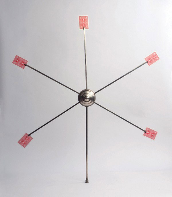 Card Star. Berlin, Conradi-Horster, ca. 1930. : Card Star. Berlin, Conradi-Horster, ca. 1930. Five cards selected from the deck instantly appear at the points of this metal skeleton-type star held in the magician's hand or in the hand of his assist