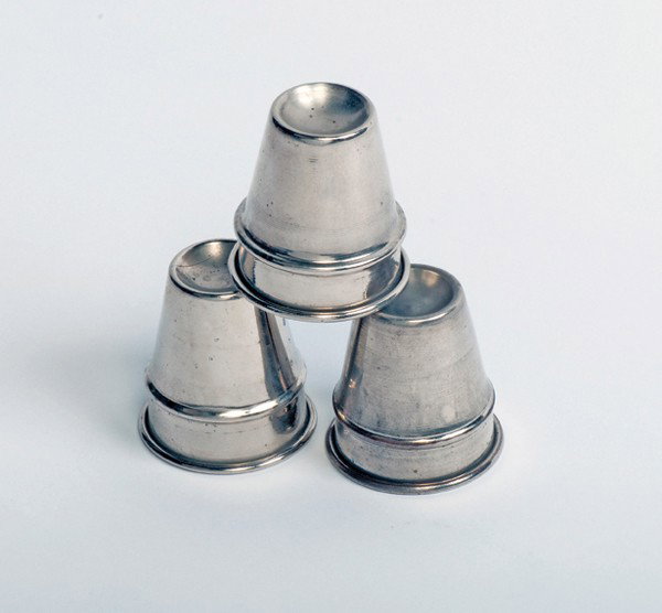 Miniature Cups. American [?], ca. 1930. : Miniature Cups. American [?], ca. 1930. Miniature set of three cups for the Cups and Balls trick. Nickel plated brass. 2 1/8" high with a mouth 1 ¾" across. Good condition.
