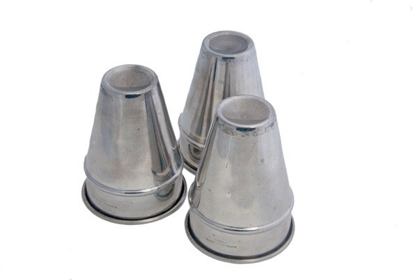 Liquid Load Cups and Balls. Chicago, National Magic: Liquid Load Cups and Balls. Chicago, National Magic Co., ca. 1940. Oversized chrome plated cups allow the magician to produce a quantity of liquid from within each cup after the performance of a tradi