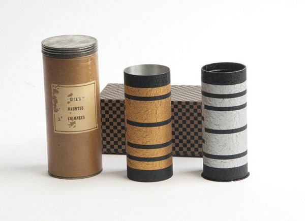 Haunted Chimneys. Cincinnati, Silk King Studios: Haunted Chimneys. Cincinnati, Silk King Studios, ca. 1950. Two metal tubes with contrasting "modernistic" finishes are shown empty. The magician then produces a large quantity of silk handkerchiefs fr