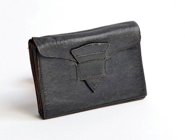 Little Johnny Jones' Accordion Wallet. American: Little Johnny Jones' Accordion Wallet. American, ca. 1940. Leather "gag" wallet that expands when opened to reveal 15 compartments, accordion-style. Owned by vaudeville magician "Little" Johnny Jones.