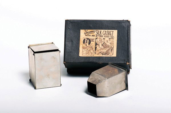 Uncanny Silk Casket. Bridgeport CT, Sherms 1940: Uncanny Silk Casket. Bridgeport Connecticut, Sherms, ca. 1940. A stainless steel box is shown empty by opening its doors. A moment later, a quantity of silk handkerchiefs are produced from inside it.