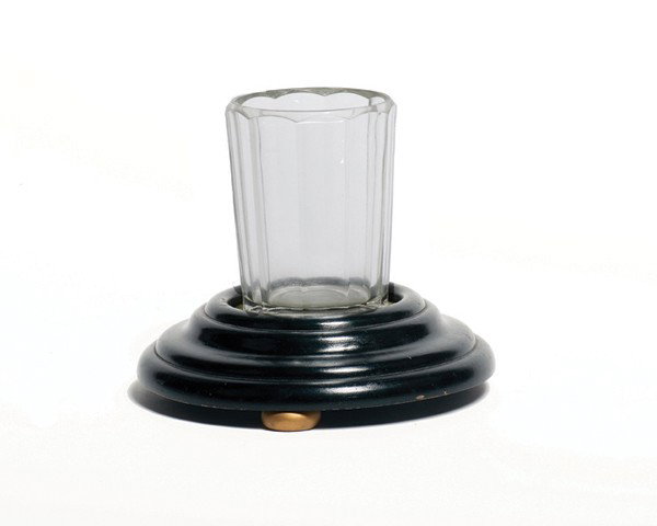 Turntable Stand. Los Angeles, F.G. Thayer & Co.: Turntable Stand. Los Angeles, F.G. Thayer & Co., ca. 1930. Low wooden stand on which the magician rests a glass. Mechanical stand allows the performer to secretly rotate the glass. Includes heavy flut