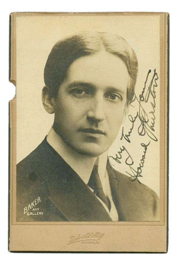 Photo portrait of Howard Thurston, signed 1909: Thurston, Howard. Photographic bust portrait of Howard Thurston, inscribed and signed. Columbus, Baker Art Gallery, ca. 1909. Handsome silver print sepia portrait of Howard Thurston in cabinet card fo
