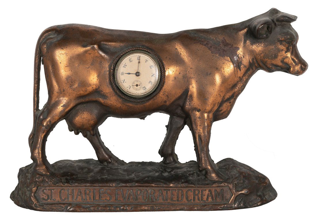 St. Charles Evaporated Cream figural advertising clock. Chicago: Regent Mfg. Co. Cast metal cow (1 of 2)