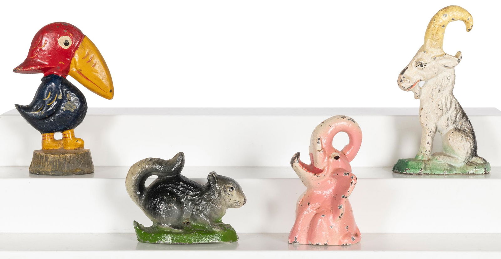 Group of 4 cast-iron figural bottle openers. (1 of 1)