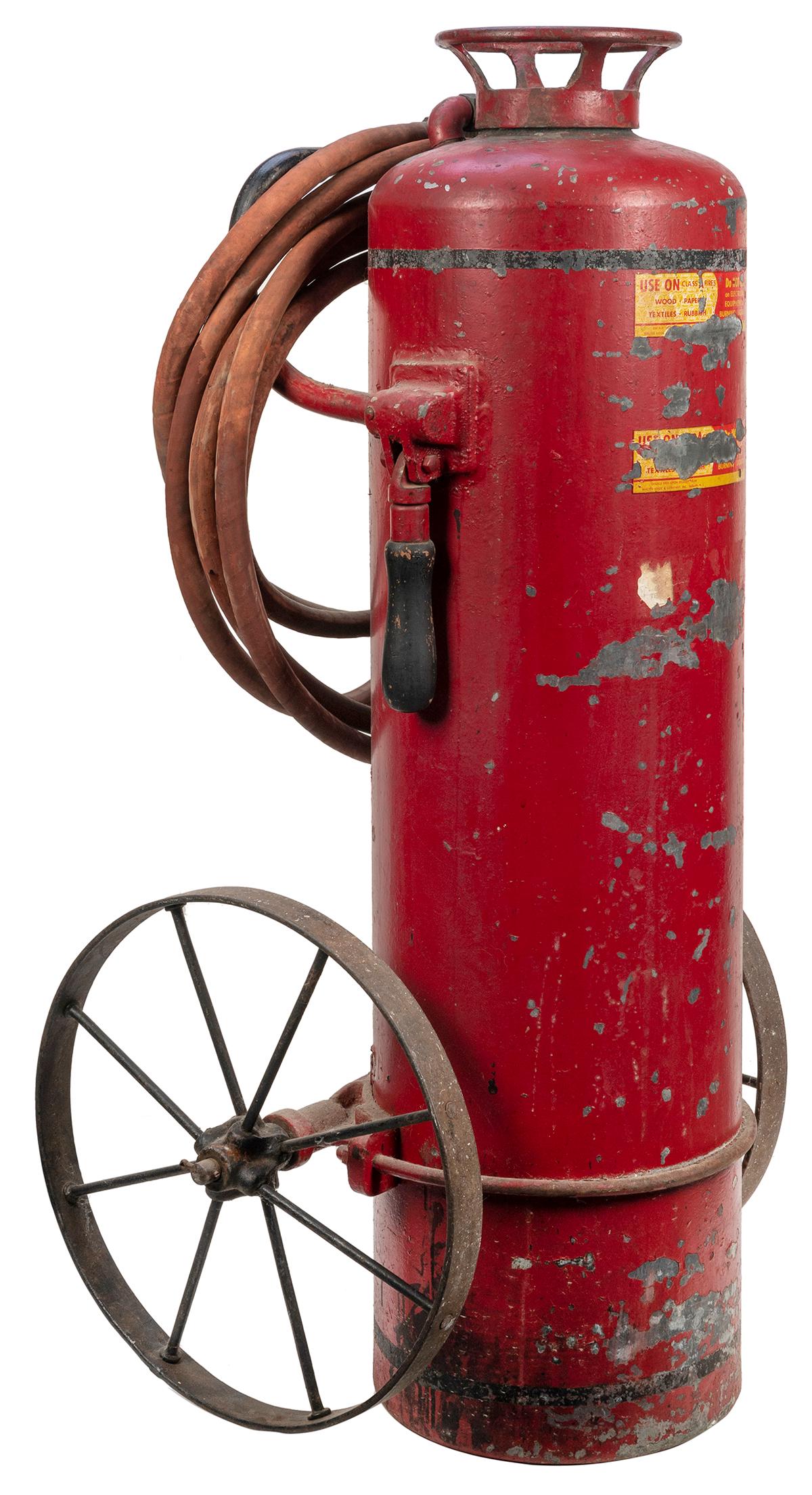 Large vintage fire extinguisher on carriage. [McElwain, n.d.]. Cast iron fire extinguisher on iron (1 of 2)