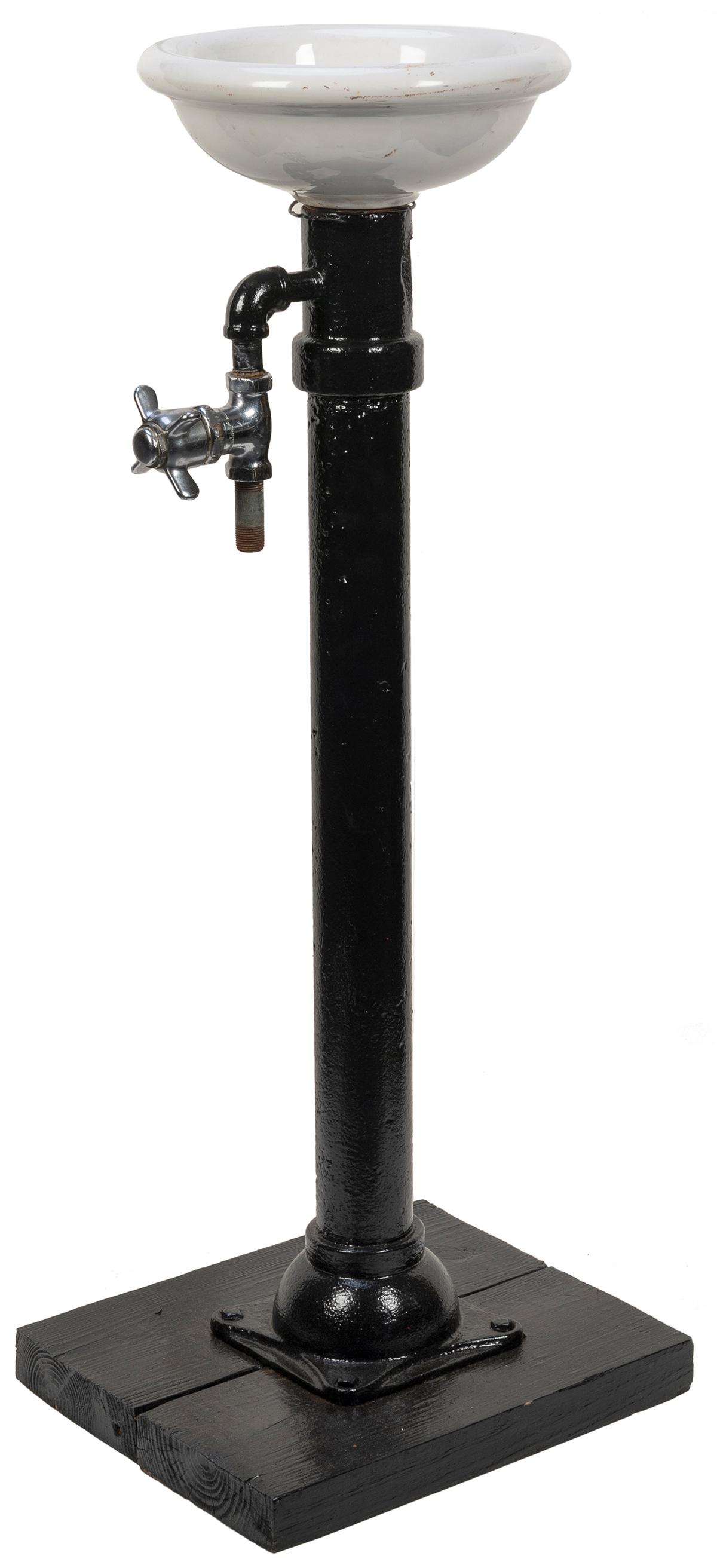 Drinking fountain with porcelain bowl. Standing water fountain [ca. 1940s-1970s]. Porcelain bowl (9: Drinking fountain with porcelain bowl. Standing water fountain [ca. 1940s-1970s]. Porcelain bowl (9 ½” diameter), metal handle, drain, spout; metal pipe and stand painted black at a later d