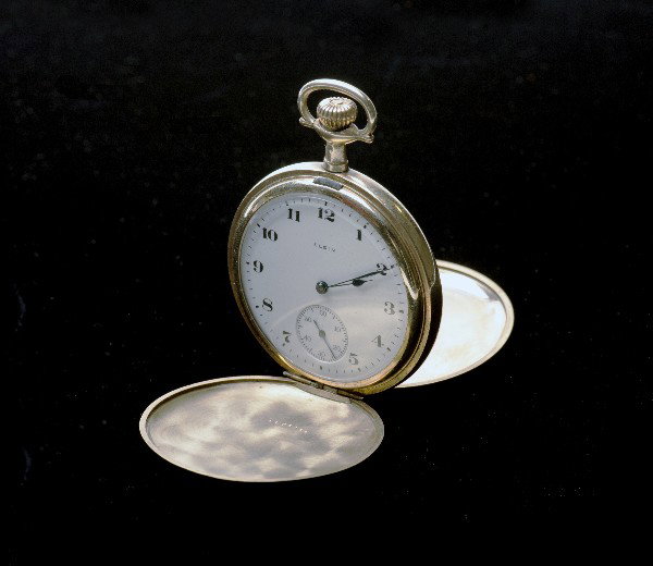Larry Jennings' pocket watch. Elgin, 1919: Jennings, Larry. Larry Jennings' pocket watch. Elgin Illinois, Elgin Watch Co., 1919. Gold plated case engraved with eagle design. Engraved with the name "Larry Jennings" inside the rear of the case i