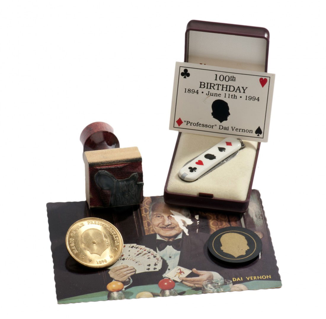 Archive of miscellaneous Dai Vernon memorabilia.: Vernon, Dai. Archive of Dai Vernon memorabilia. Including a brass Vernon "spinning" coin, Vernon poker chip bearing his silhouette and signature, a souvenir pocket knife made to commemorate Vernon's 1