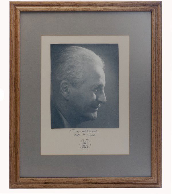 Photograph of Dai Vernon, inscribed and signed.: Vernon, Dai. Photograph of Dai Vernon, inscribed and signed. [Hollywood], ca. 1965. Profile photo of Vernon crudely trimmed and mounted. Framed and glazed. Overall size of 18 x 22 ½". Inscribed and s