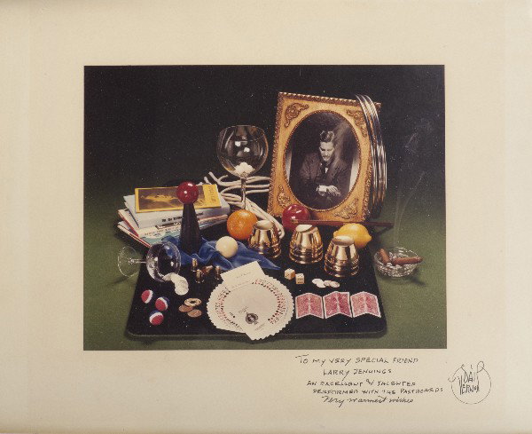 Inscribed photomontage from The Vernon Chronicles: Vernon, Dai. Photomontage from The Vernon Chronicles, inscribed and signed. California, ca. 1987. Color image depicting books, props and Vernon ephemera, as used on the cover of The Vernon Chronicles