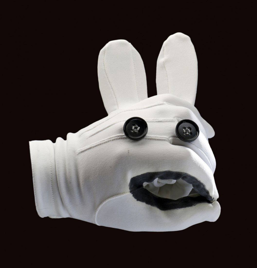 Jay Marshall's Glove Puppet, Lefty.: Marshall, Jay (James Ward Marshall). Jay Marshall's Glove Puppet, Lefty. Glove puppet rabbit crafted from two white dress gloves by Jay Marshall himself, with black buttons sewn in place for eyes, bla