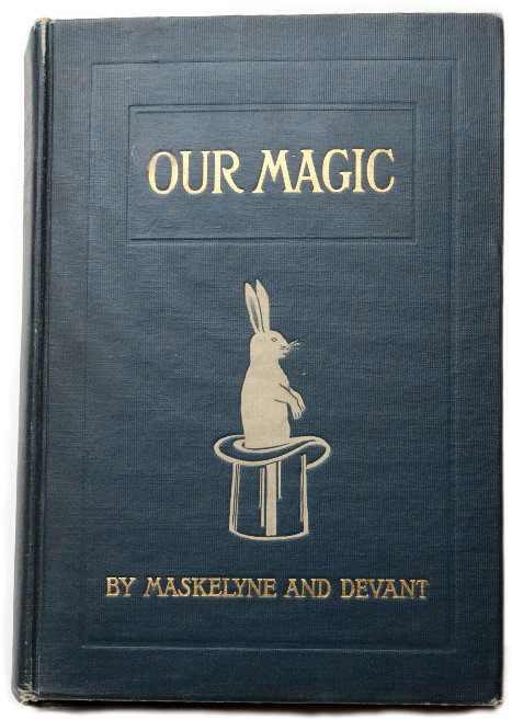 Maskelyne, Nevil and David Devant. Our Magic.: Maskelyne, Nevil and David Devant. Our Magic. Philadelphia, 1911. American edition. Blue cloth stamped in white and gold. Illustrated with photographs. Thick 8vo. Martinka overslip and rubber stamp on