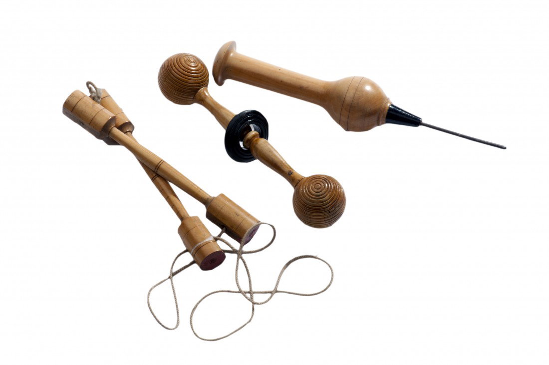 Group of three turned boxwood magic tricks/puzzles: [Wood Turnings] Group of three turned boxwood magic tricks/puzzles. European, ca. 1890s. Including Pillars of Solomon, a Magic Awl (ice pick), and turned wooden puzzle, as described in the books of Pr