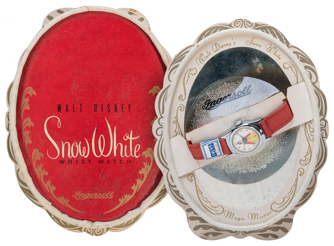 Ingersoll Snow White Wristwatch. [Ingersoll, 1950]. Child's...: Ingersoll Snow White Wristwatch. [Ingersoll, 1950]. Child’s wristwatch with red cloth band, with manufacturer’s price tag, in original oval pictorial box with the rare “Magic Mirror&