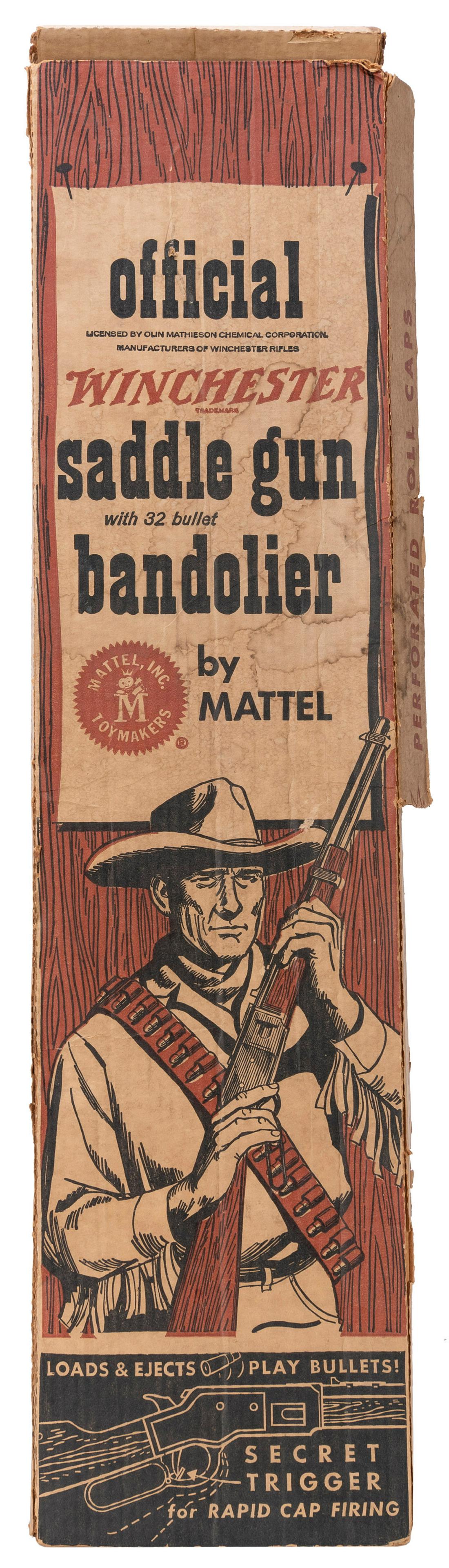 Mattel Official Winchester Saddle Gun with 32-bullet bandol...: Mattel Official Winchester Saddle Gun with 32-bullet bandolier. Los Angeles: Mattel, Inc., 1958. Original plastic and metal cap-gun rifle with original cowhide bandolier belt with all 32 toy bullets. 