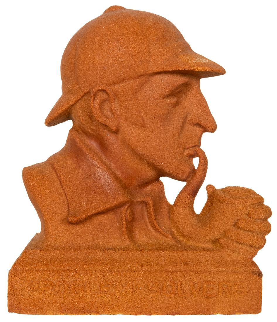A pair of busts of Sherlock Holmes. Including: A bust of Sh...: A pair of busts of Sherlock Holmes. Including: A bust of Sherlock Holmes, captioned “Problem Solvers”. Redford Foundry, [n.d.] Sandcast bust, approximately 6 x 8”; 152 x 203 mm. Some