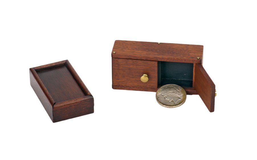 Maggie’s Night Out. Lake Forest, John McKinven: Maggie’s Night Out. Lake Forest, John McKinven, ca. 1988. The classic “sucker” Die Box trick in miniature form, performed with a small two-door cabinet and a silver dollar. Hallmarked. Accompani