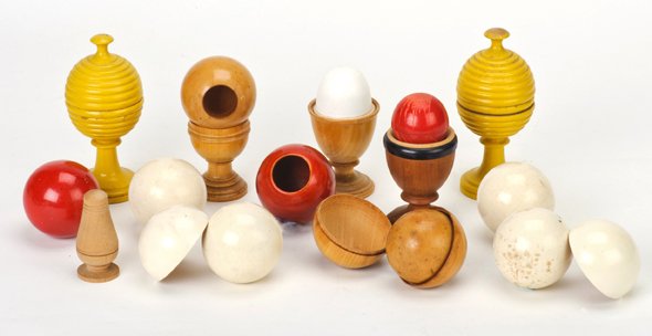 Group of nine turned wooden magic tricks. 1920s.: [Wood Turnings] Group of nine turned wooden magic tricks. Including two Ball Vases, two Egg Vases/Cups, a small Marble/Jam Vase, hollow turned billiard balls, and a set of Multiplying Billiard Balls w