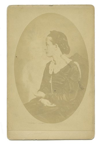 Spirit photograph of medium Mrs. J.H. Conant 1880s: [Spirit Photograph] Photograph of medium Mrs. J.H. Conant and her spirit guide. Boston, Colby & Rich, ca. 1880. Albumen cabinet card ¾ length portrait of Conant, seated, with her Native American spir