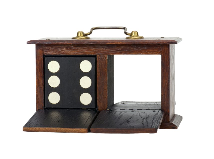 Die Box. European, ca. 1950. Four-door: Die Box. European, ca. 1950. Four-door die box for the classic transposition effect. A wooden die vanishes from the box and reappears elsewhere. Includes wooden shell with pivoting flap, and wooden di