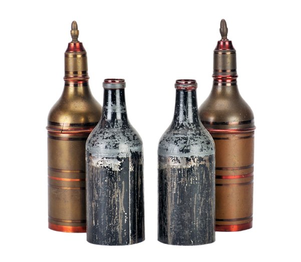 Passe Passe Bottles. European, ca. 1885.: Passe Passe Bottles. European, ca. 1885. A small bottle and glass magically transpose under two metal covers. Lacquered brass covers stand 7 ¼” high. Finish of bottles worn, otherwise good conditio