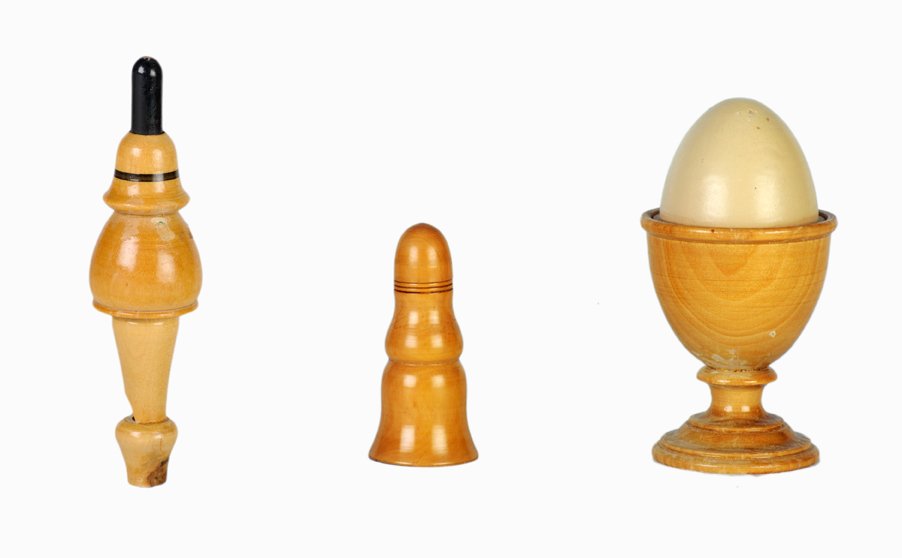 Group of three turned wooden magic tricks: [Wood Turnings] Group of three turned wooden magic tricks. Including a small Pillar of Solomon (French, ca. 1870s); Egg Cup (German, ca. 1900); and boxwood Soot Whistle (ca. 1890). All three in good c