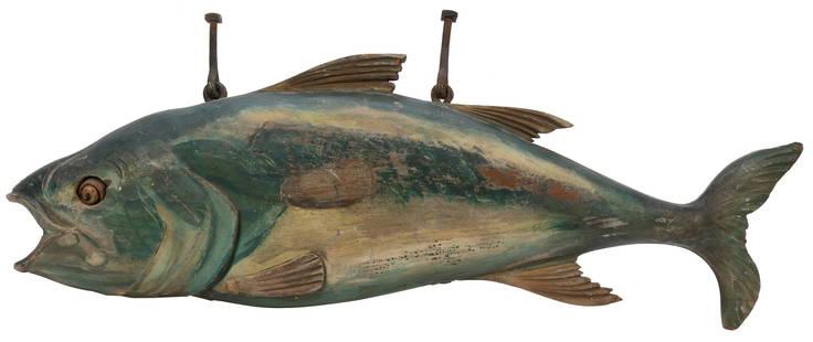 Hand-Carved and Painted Fish Trade Sign. Circa 1900s-1940s....: Hand-Carved and Painted Fish Trade Sign. Circa 1900s-1940s. Large carved, painted wooden trade sign of a fish with cast iron hangers. 28&#8221; long. Some wear, soiling due to age and use. A beautiful