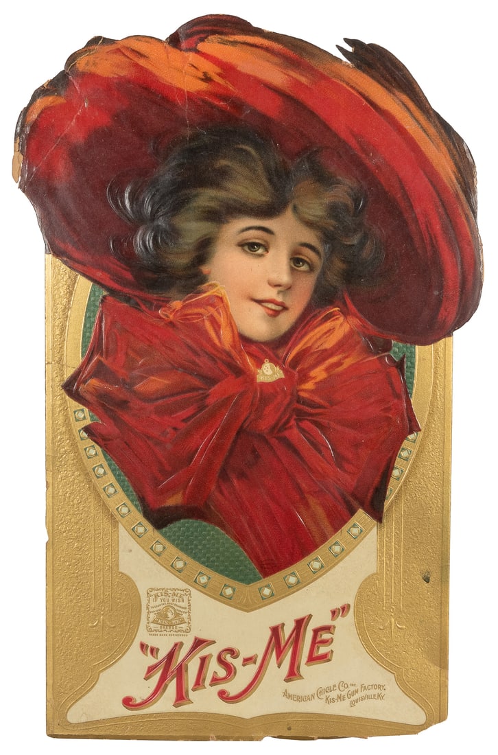“Kis-Me” American Chicle Co. Die Cut Standee. Louisville, K...: “Kis-Me” American Chicle Co. Die Cut Standee. Louisville, KY: American Chicle Co., ca. 1890s-1910s. Die cut full color, embossed illustration on cardstock. 17 ¼ x 11 ¼”. Ed