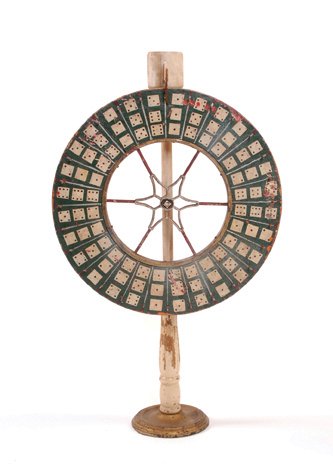 Gambling/Carnival dice wheel. American, ca. 1910. : Gambling/Carnival dice wheel. American, ca. 1910. Reversible hand painted dice-motif wheel with number wheel on reverse. On brass base. 35” tall, 20” in diameter. G.