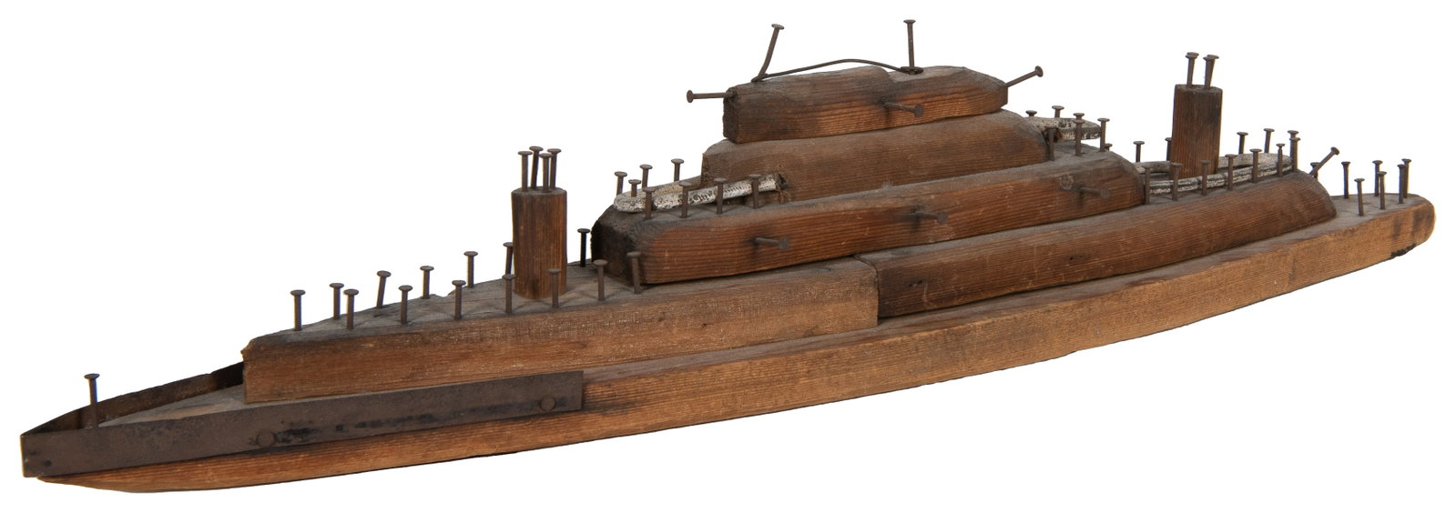 [FOLK ART]. PETERSON, Clifford and Kenneth. Hand-Built Mode...: [FOLK ART]. PETERSON, Clifford and Kenneth. Hand-Built Model of a Battleship [1933]. Wooden model with nails, tin, and wire accents. Signed at the bottom. Approximately 22 ½ x 4 x 5”. Worn,