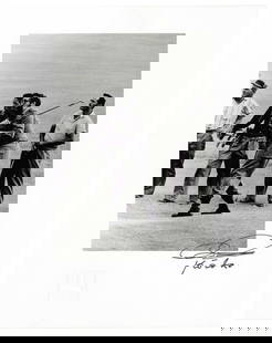 [CASTRO, Fidel Alejandro (1926-2008)]. KORDA, Alberto (1928...: [CASTRO, Fidel Alejandro (1926-2008)]. KORDA, Alberto (1928-2001). Photograph of Fidel Castro Playing Golf. 1960, though this is a later printing. On glossy paper. 8 ¼ x 5 ½”; sheet