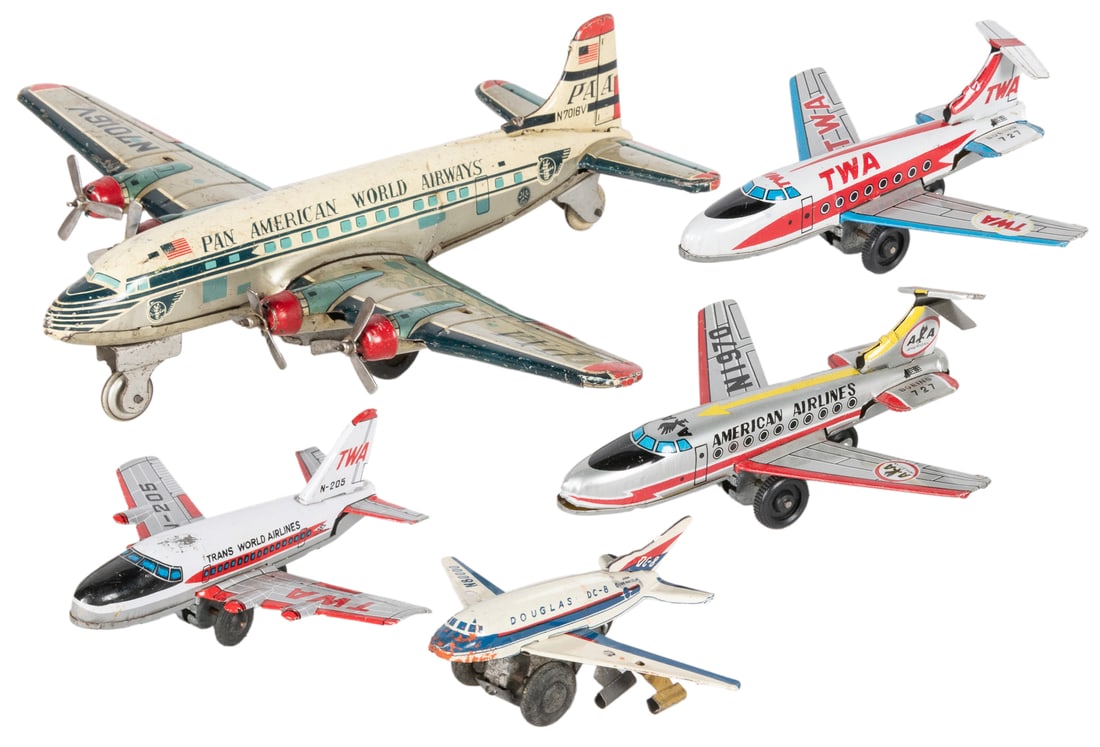Group of 5 Tin Friction Japanese Commercial Airplane Toys. ...: Group of 5 Tin Friction Japanese Commercial Airplane Toys. Circa 1960s. Including: Pan American N7016V; American Airlines Boeing 727; TWA Boeing 727; TWA N-205; and Douglas DC-8. Size of largest 9R